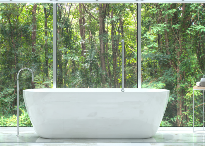White bathroom with rainforest in background.